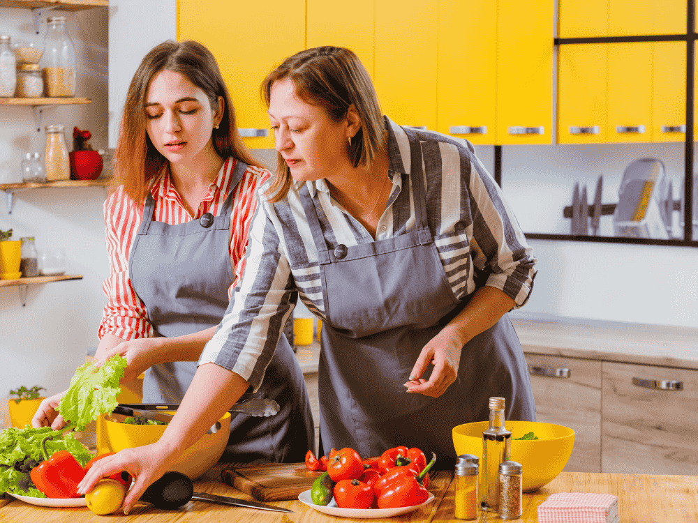 A cooking vlog hosted by two women chefs using a wireless microphone