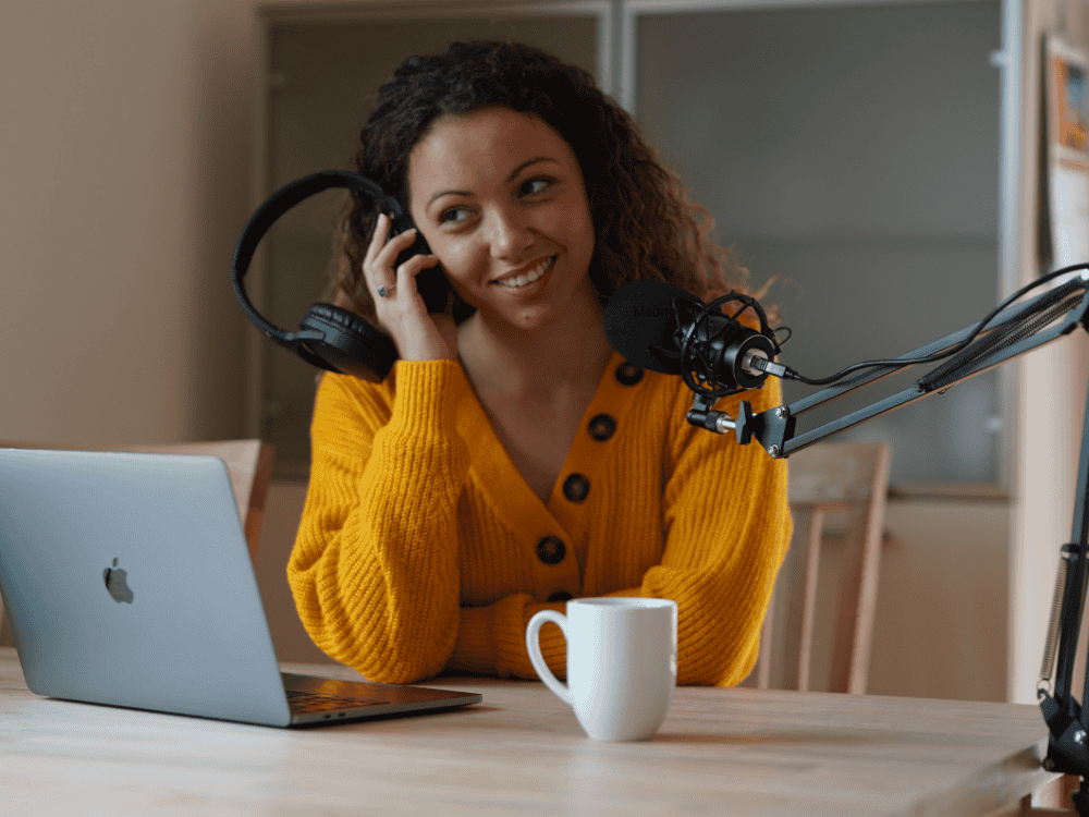 A lady podcaster preparing for recording using a podcast microphone