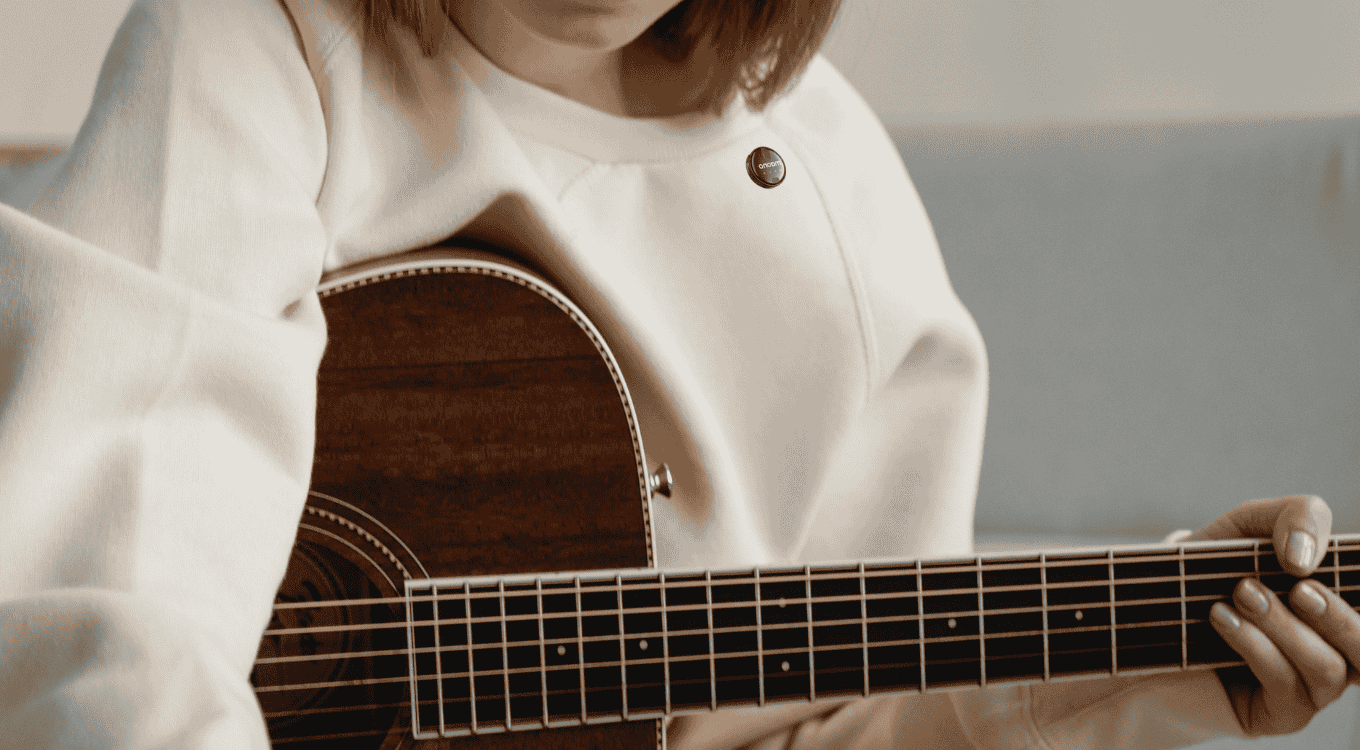 A lady musician recording a melody using a wireless microphone